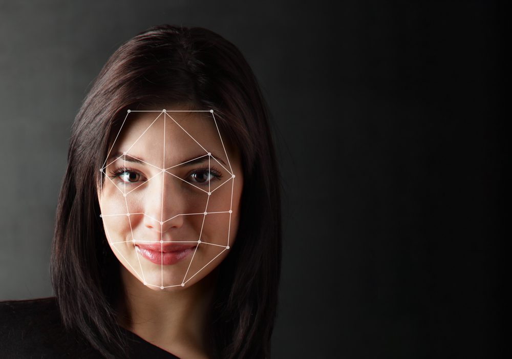 A woman's face being scanned and created using CGI technology.