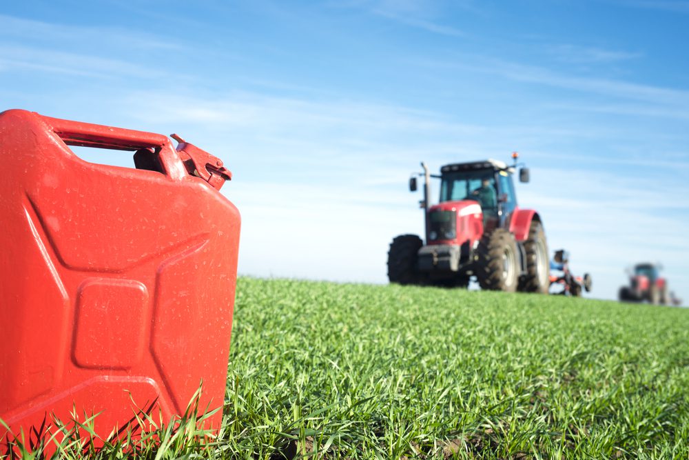 A farm with a gas cannister in the foreground.