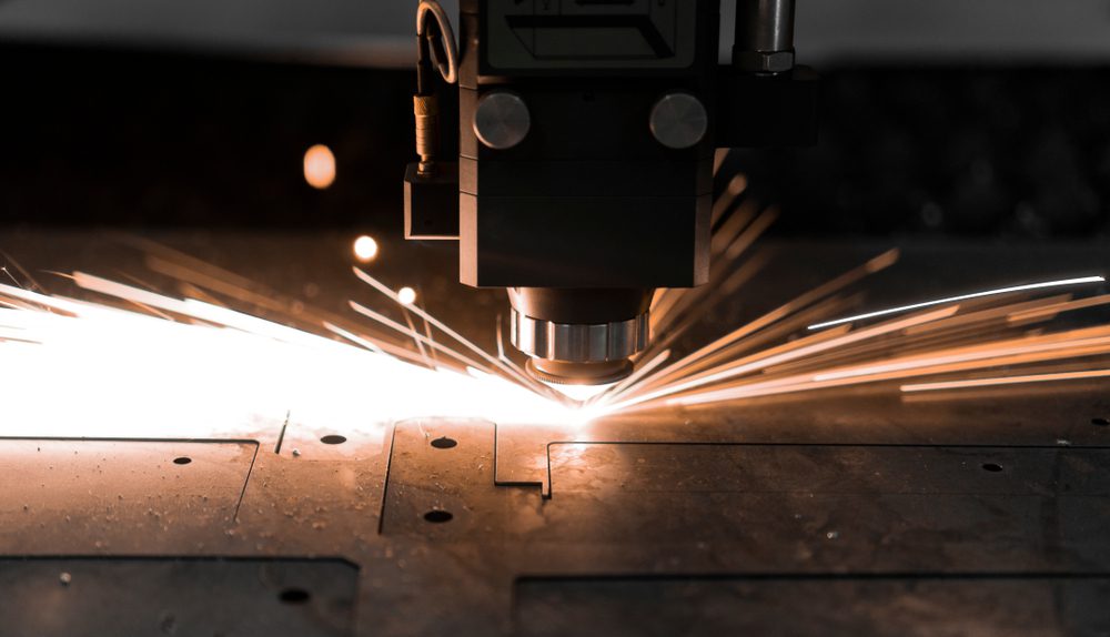 A laser cutting through steel