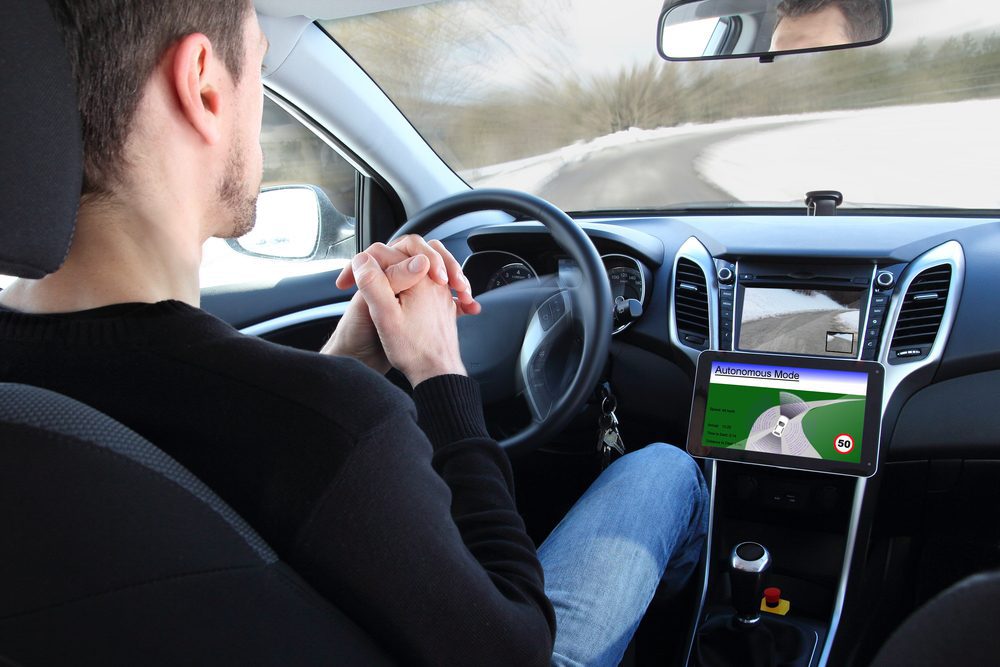 Man in a self-driving car