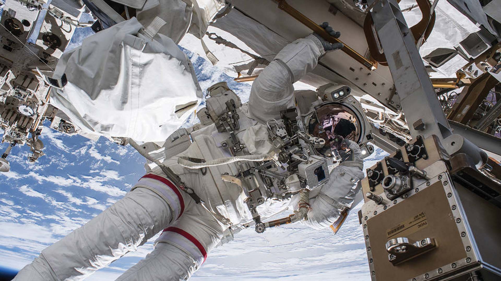 NASA astronaut Drew Feustel seemingly hangs off the International Space Station