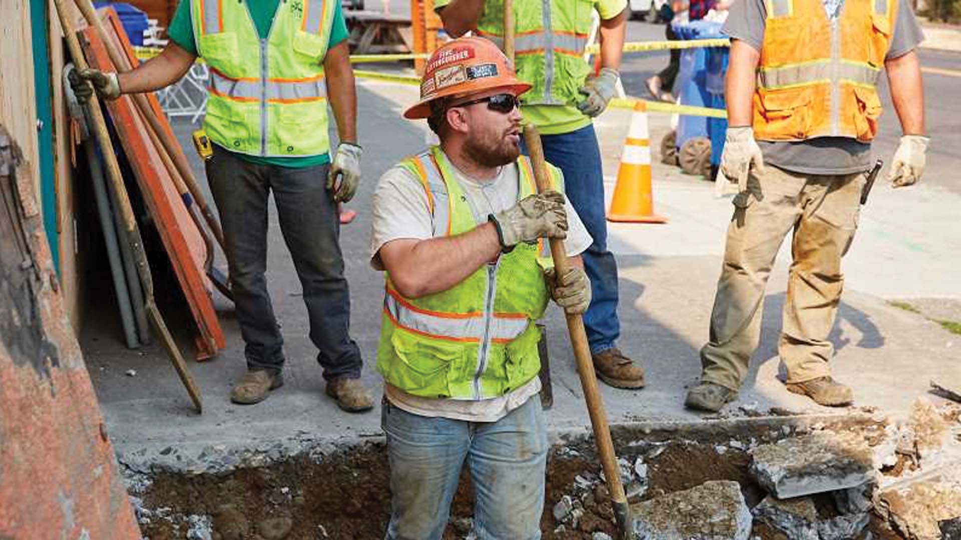 Portland Water Bureau worker prepares land for pipe installation