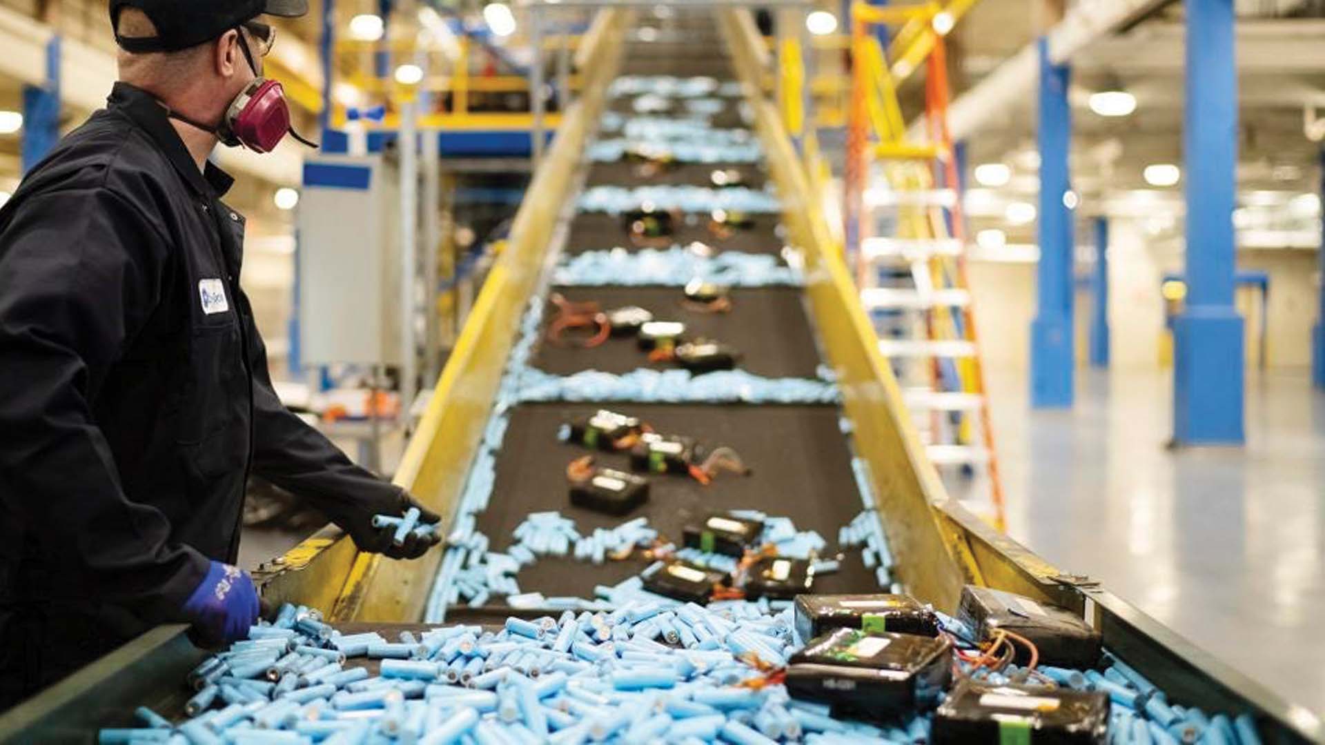 Li-Cycle employees recycling lithium-ion batteries