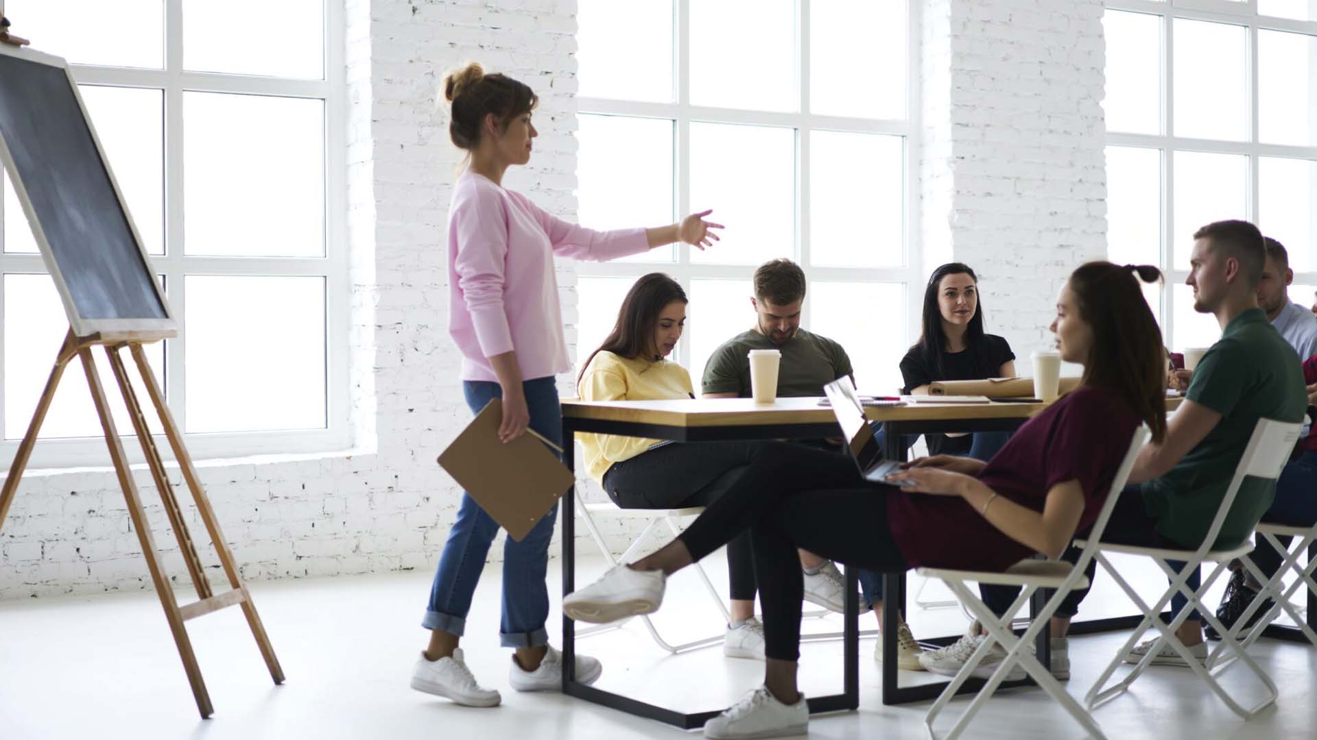 A group of people attending an artists' workshop.