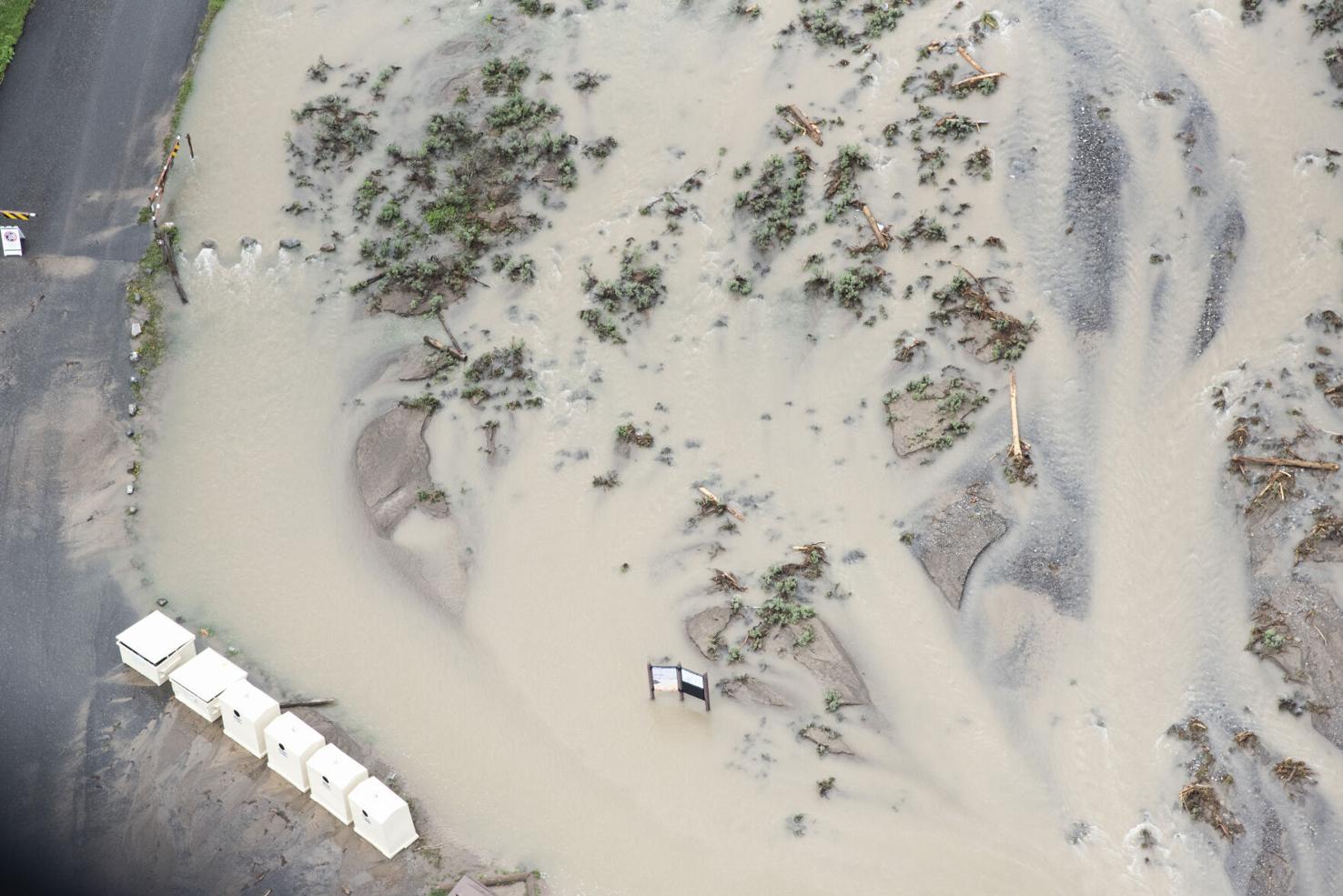 A flooded parking area, June 19, 2022; Photo Credit: Samuel Wilson/Bozeman Chronicle