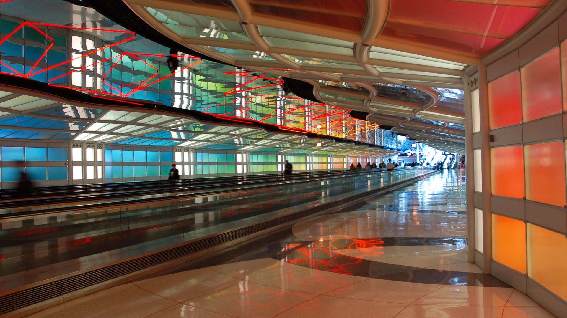 Chicago O'Hare Airport "Skys The Limit" installation with neon lights alongside passenger walkway