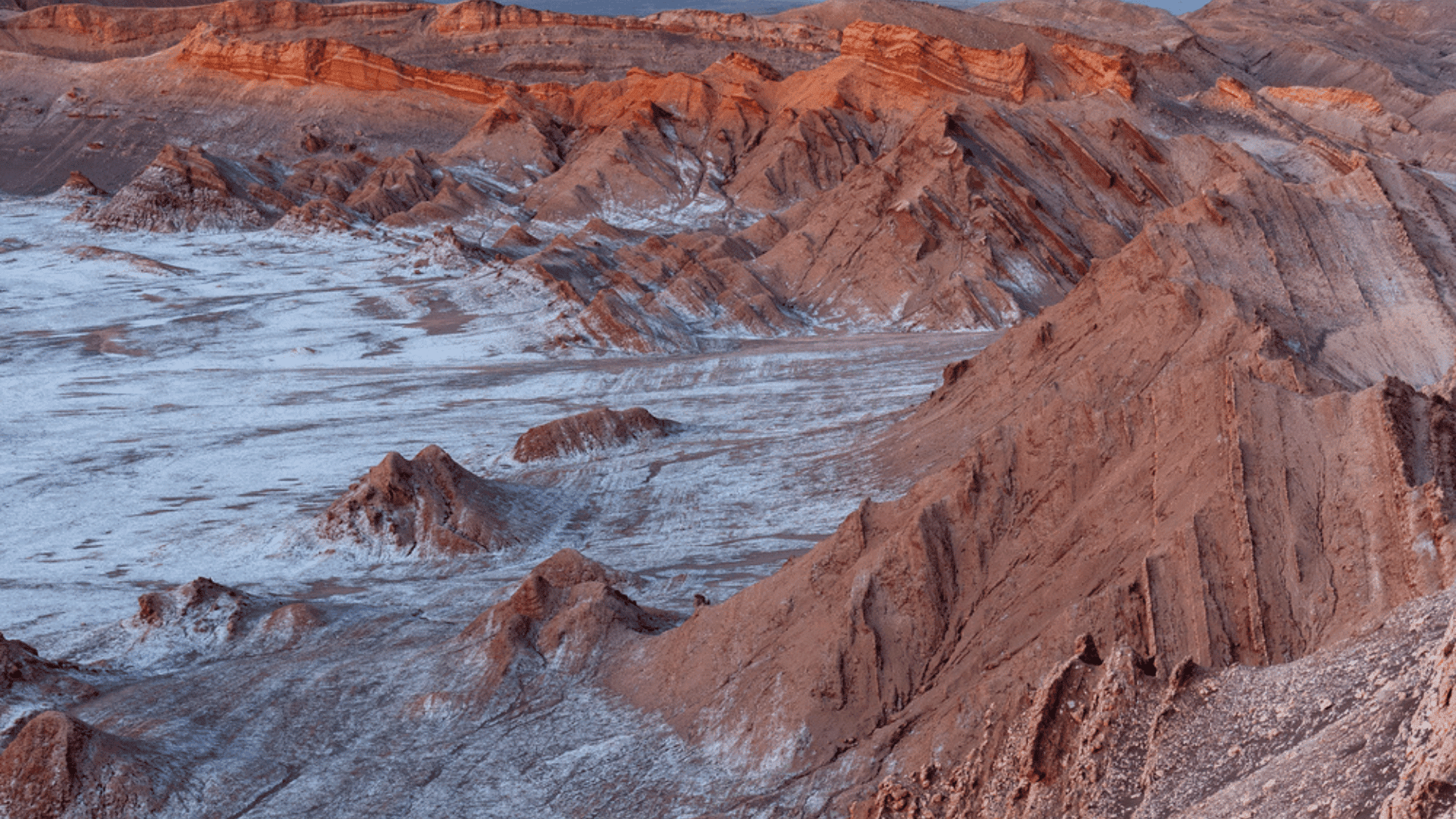 First rays of dawn sunlight at El Valle de la Luna (Valley of the Moon)