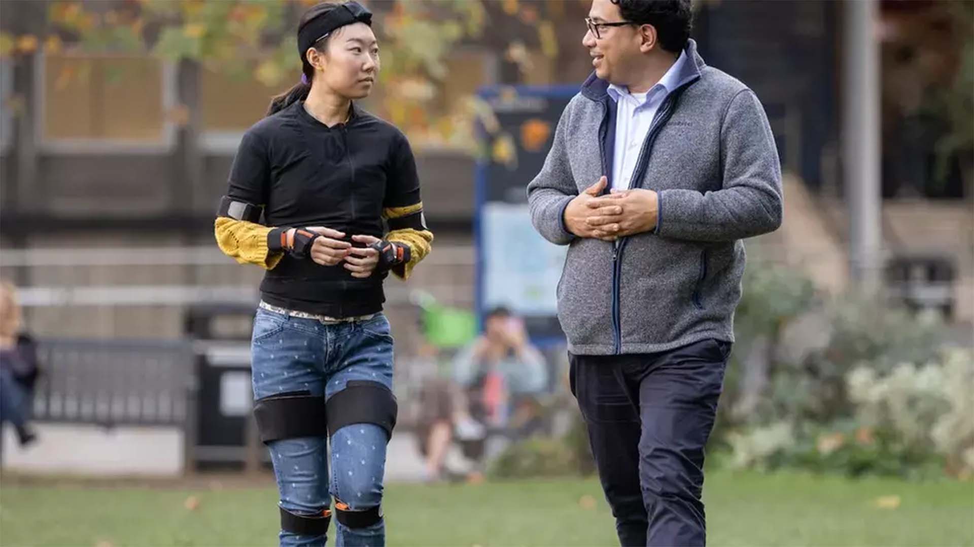 Professor Aldo Faisal with a patient testing out the AI motion capture suits technology