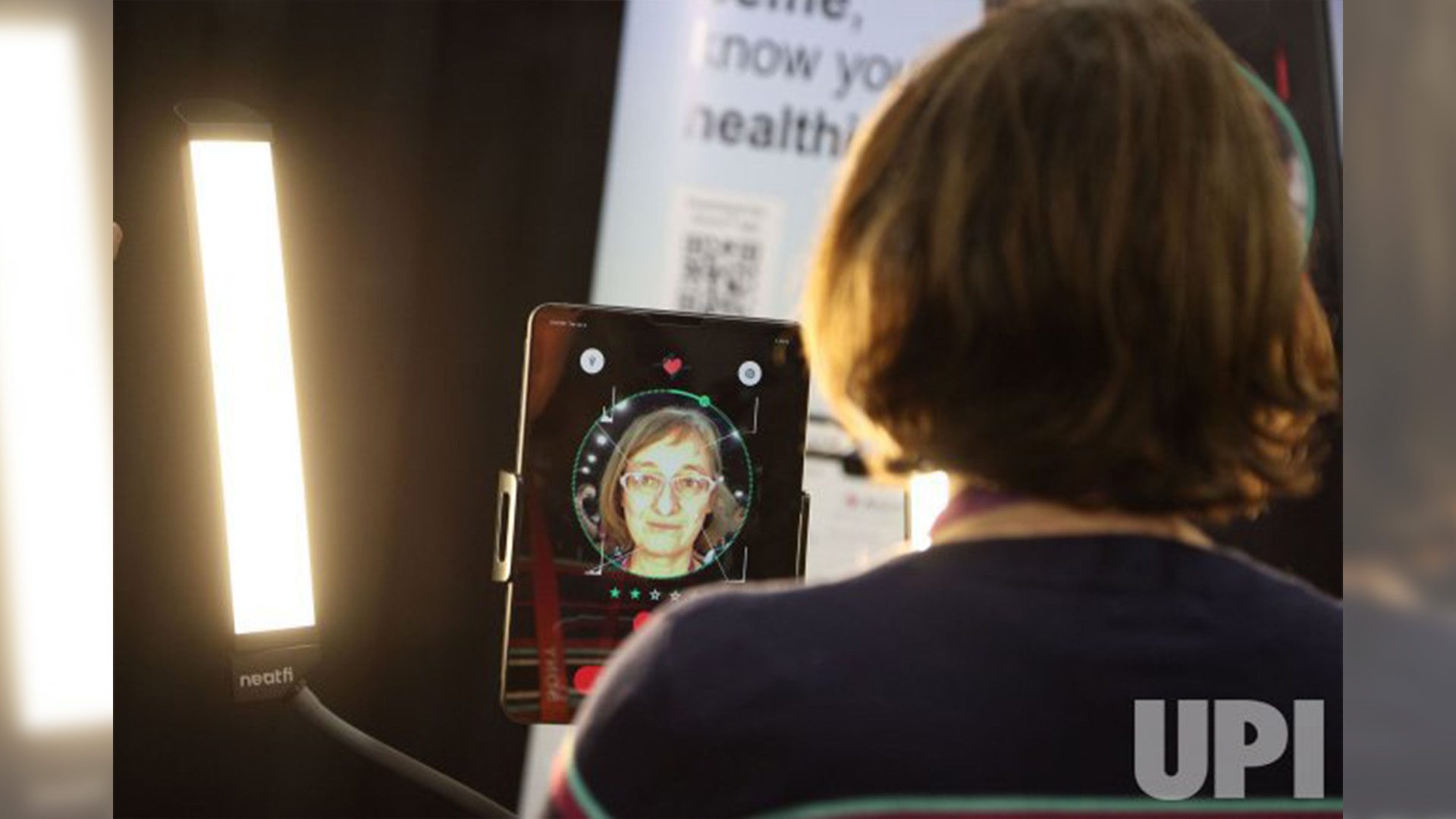 CES 2023 attendee takes a selfie using the Anura health app