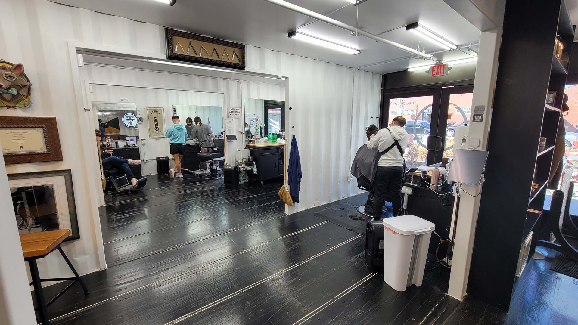 Interior of tonsorial, a barbershop inside The Boxyard