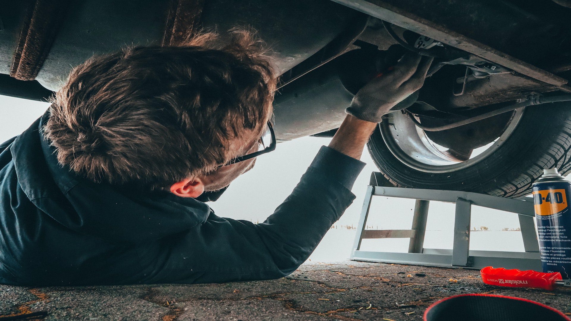 Man fixing engine of a car