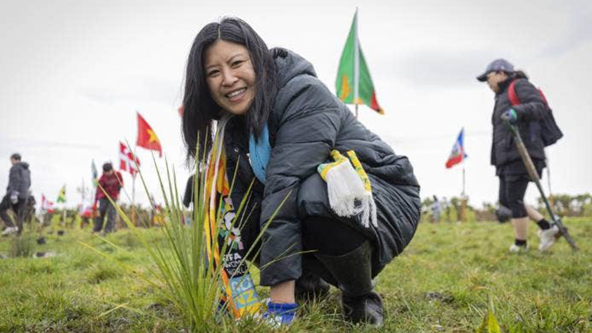 Dr. Sheila Nguyen planting trees at the Puhinui Reserve