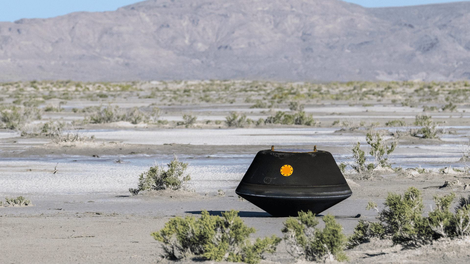 The sample return capsule from NASA’s OSIRIS-REx mission shortly after touching down in the desert on Sunday, Sept. 24, 2023