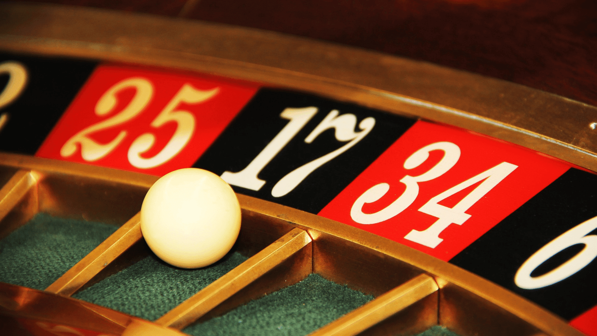 A roulette ball in a green pocket