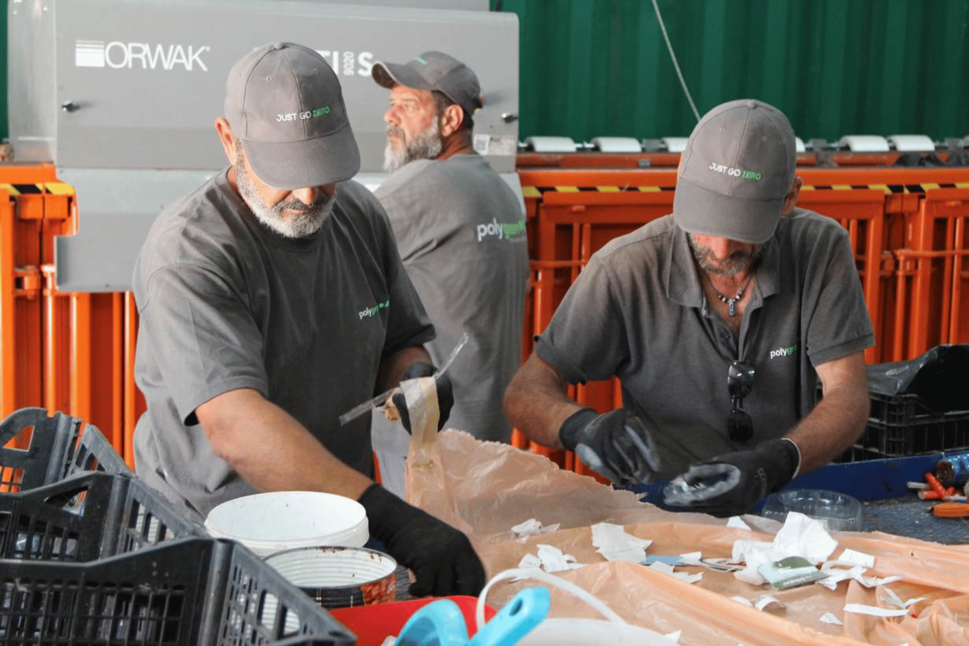 Workers sort through municipal waste at a Polygreen recycling factory