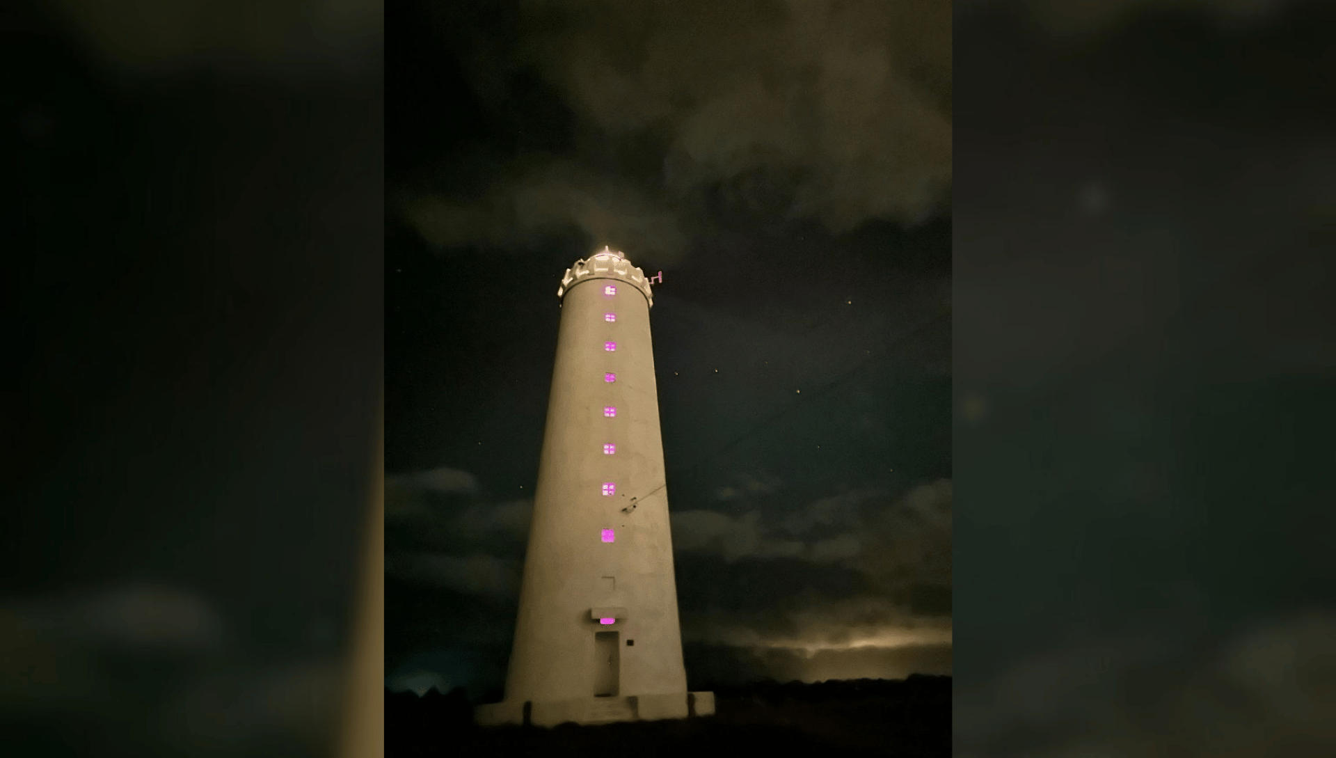 Grotta Lighthouse lit up at night, venue for Precious Okoyomon and Dozie Kanu’s installation, Reykjavik. Courtesy of Sequences XI