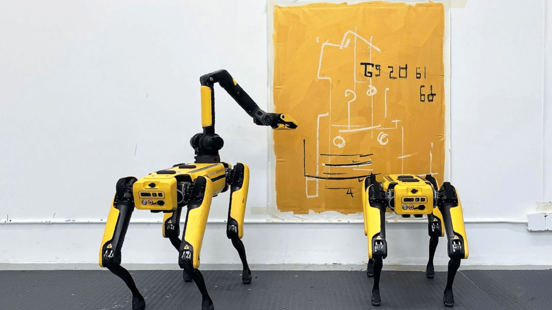 Two of the robots, Basia and Bonnie, with their work National Gallery of Victoria