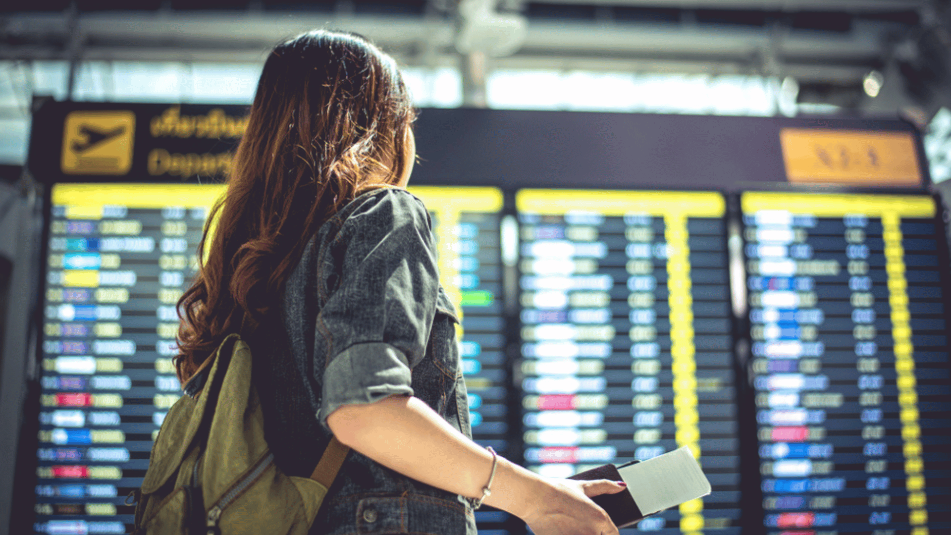 Woman Looking At Flights Holiday Travel Tips