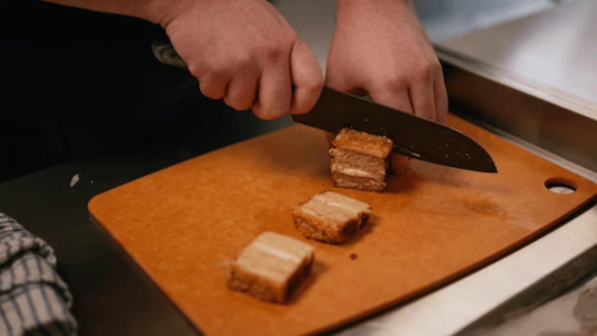 Josh Hatfield, new product development chef, cooks plant-based pork belly at Hoxton Farms Kitchen in London on Nov. 21. (Jose Sarmento Matos for The Washington Post)