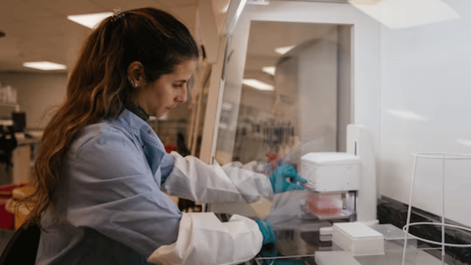 Liliana Brito, a stem cell scientist, feeds the food used to grow the cells at a London lab for Hoxton Farms on Nov. 21. (Jose Sarmento Matos for The Washington Post)