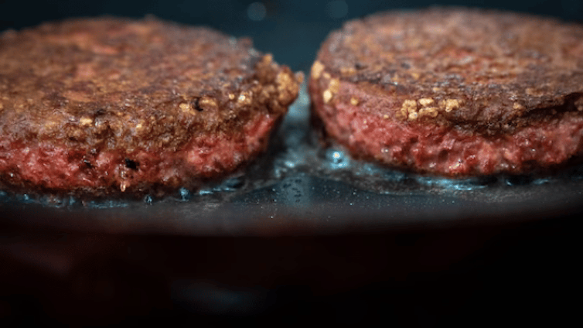 Two patties of Beyond Meat's Beyond Burger cook on a skillet in Brooklyn. (Drew Angerer:Getty Images)