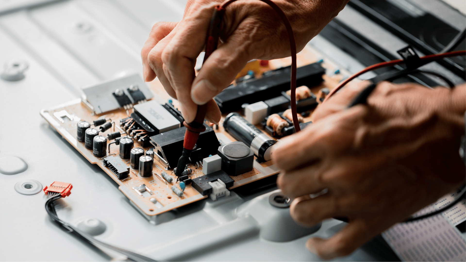 Technician measuring voltage electronic circuit board electric equipment tomorrows world today
