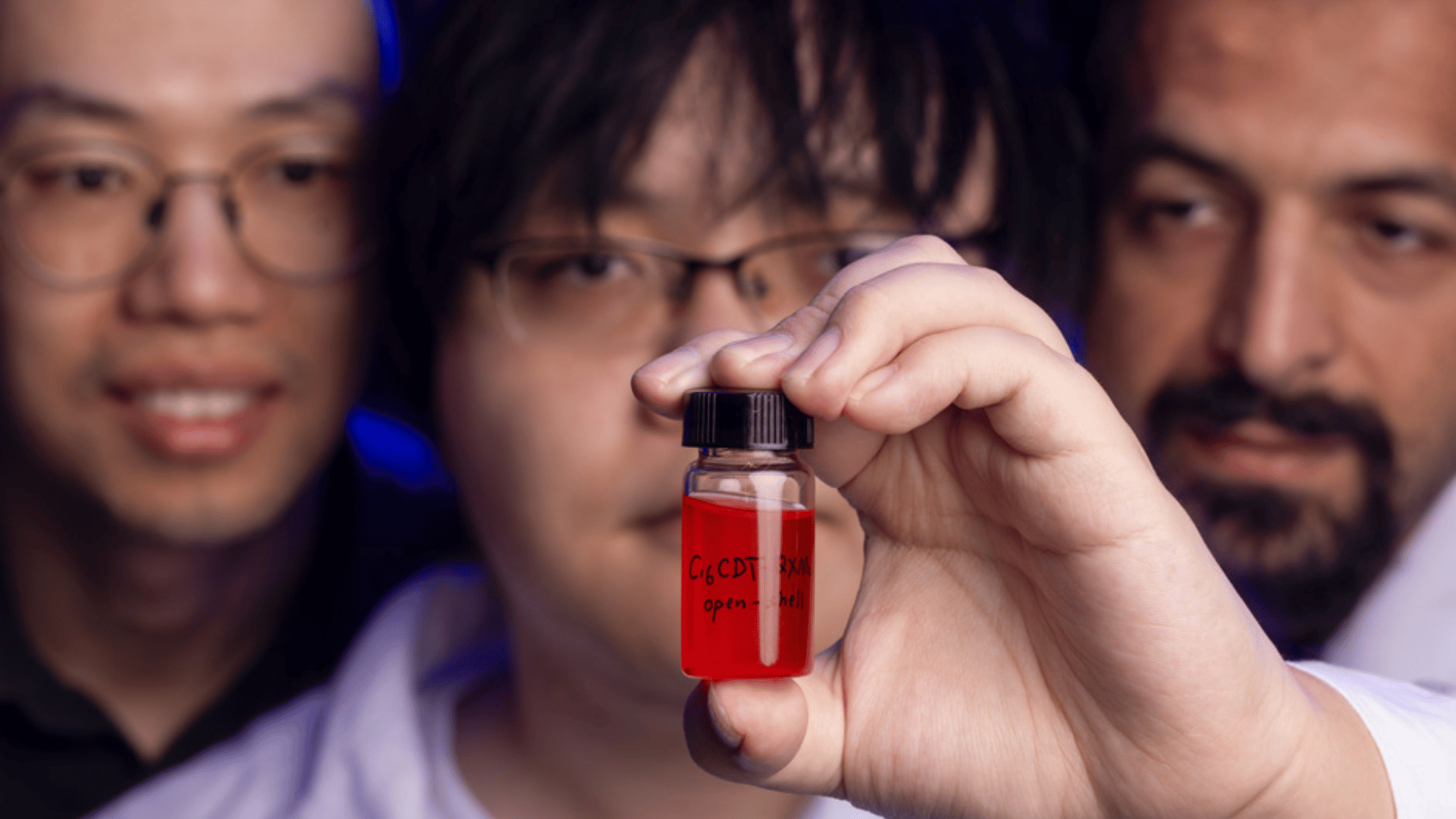 Researchers with molecule solution
