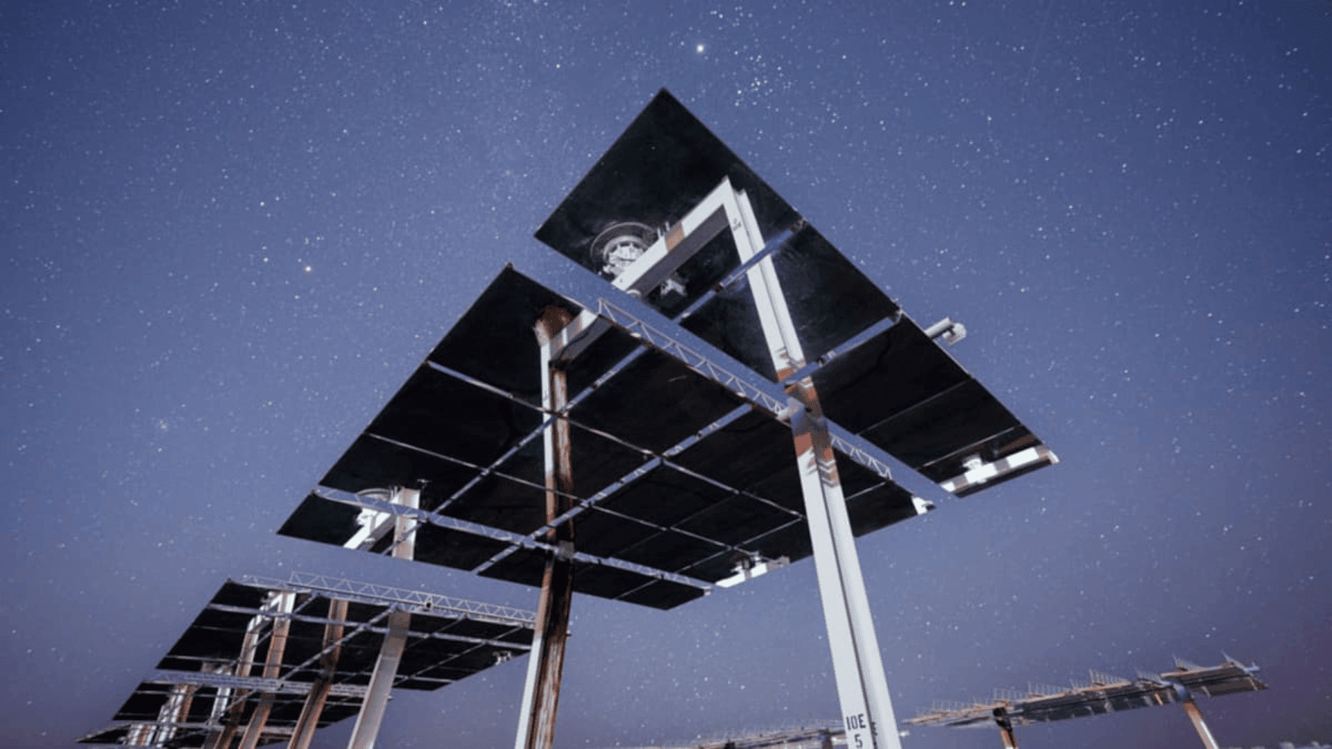 Heliostats at Sandia's solar test facility under a clear, star-filled night sky. Craig Fritz:Sandia