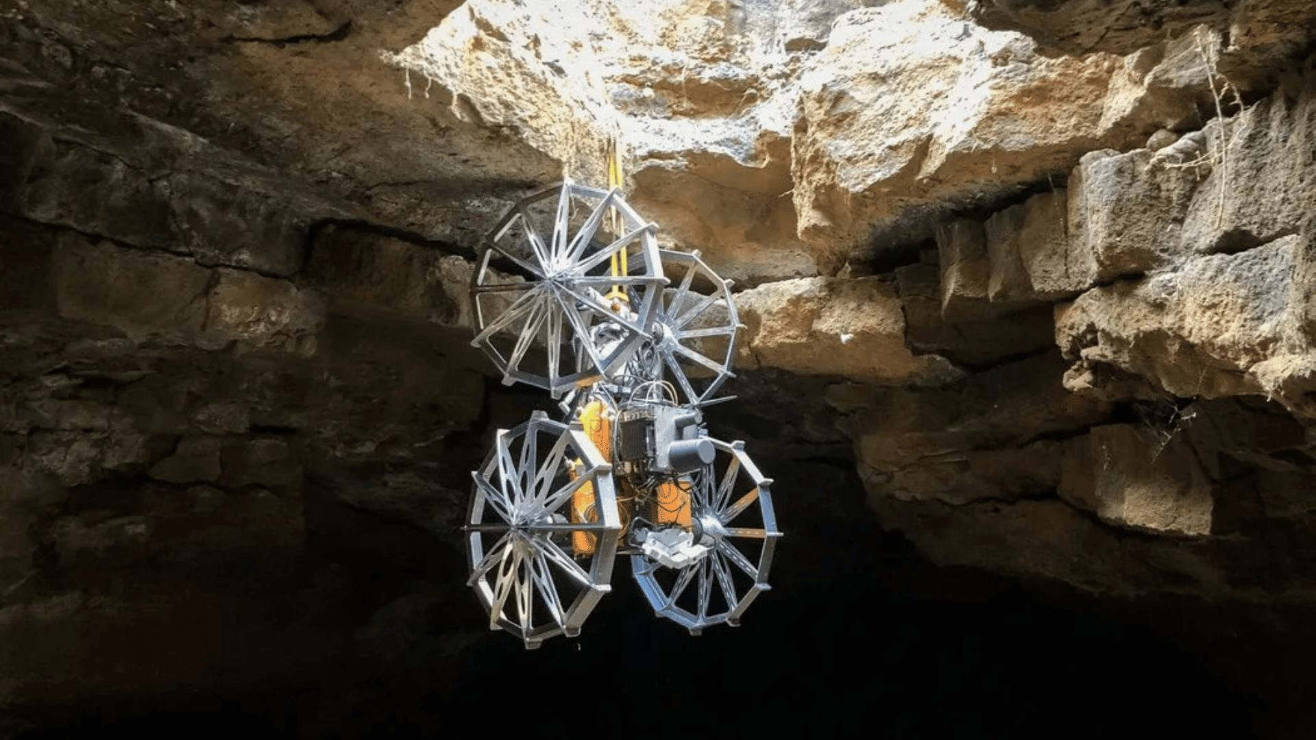 Coyote III descends into the cave on a tether system managed and supported by SherpaTT. Credit – DFKI, Tom Becker