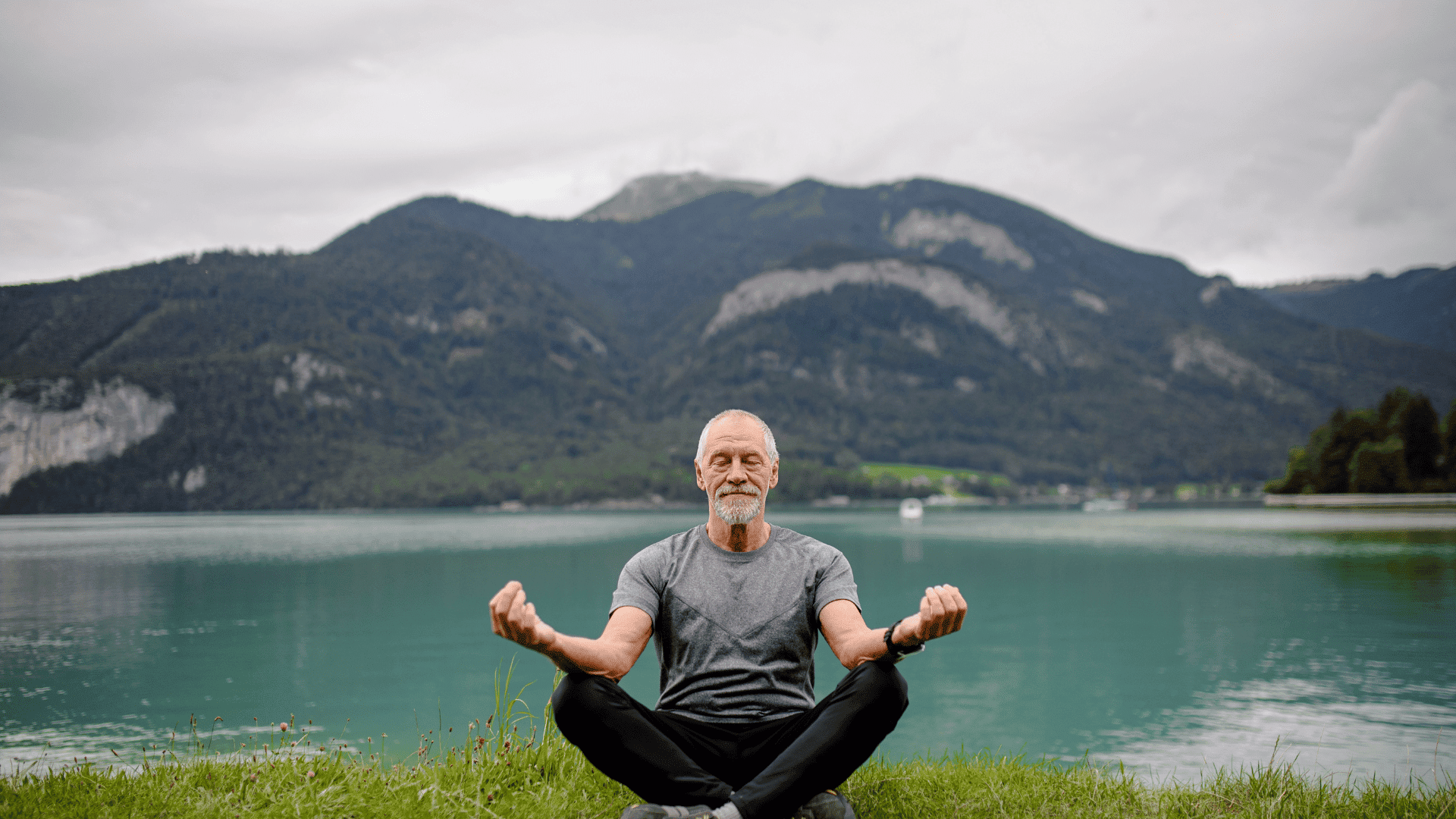 Man meditating in the mountains