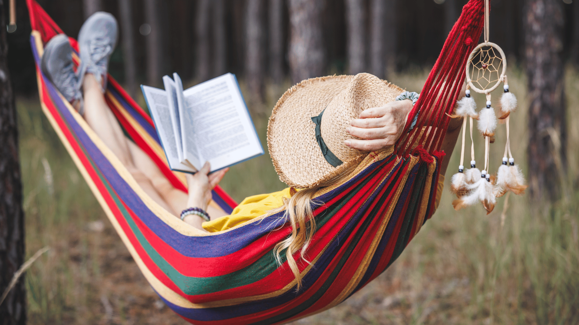 Person reading in a hammock Person reading in a hammock