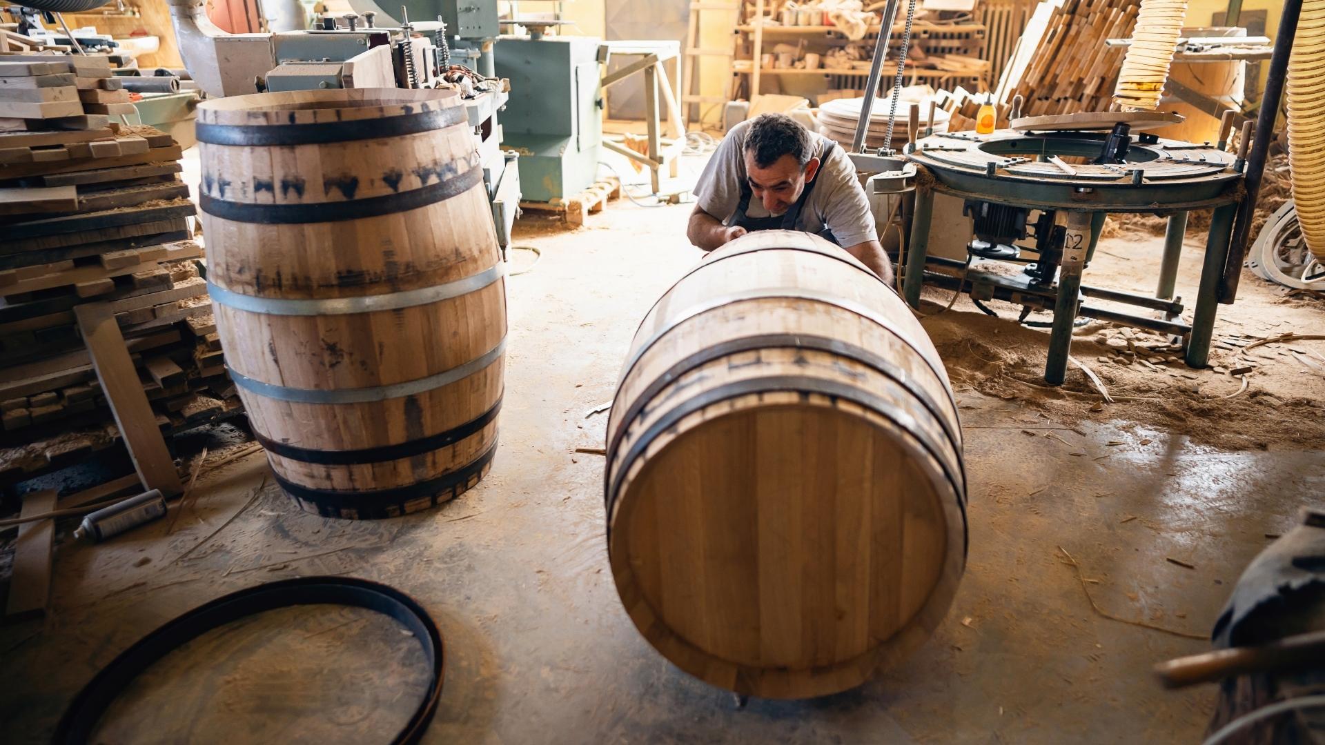 cooper making barrel; cooperage