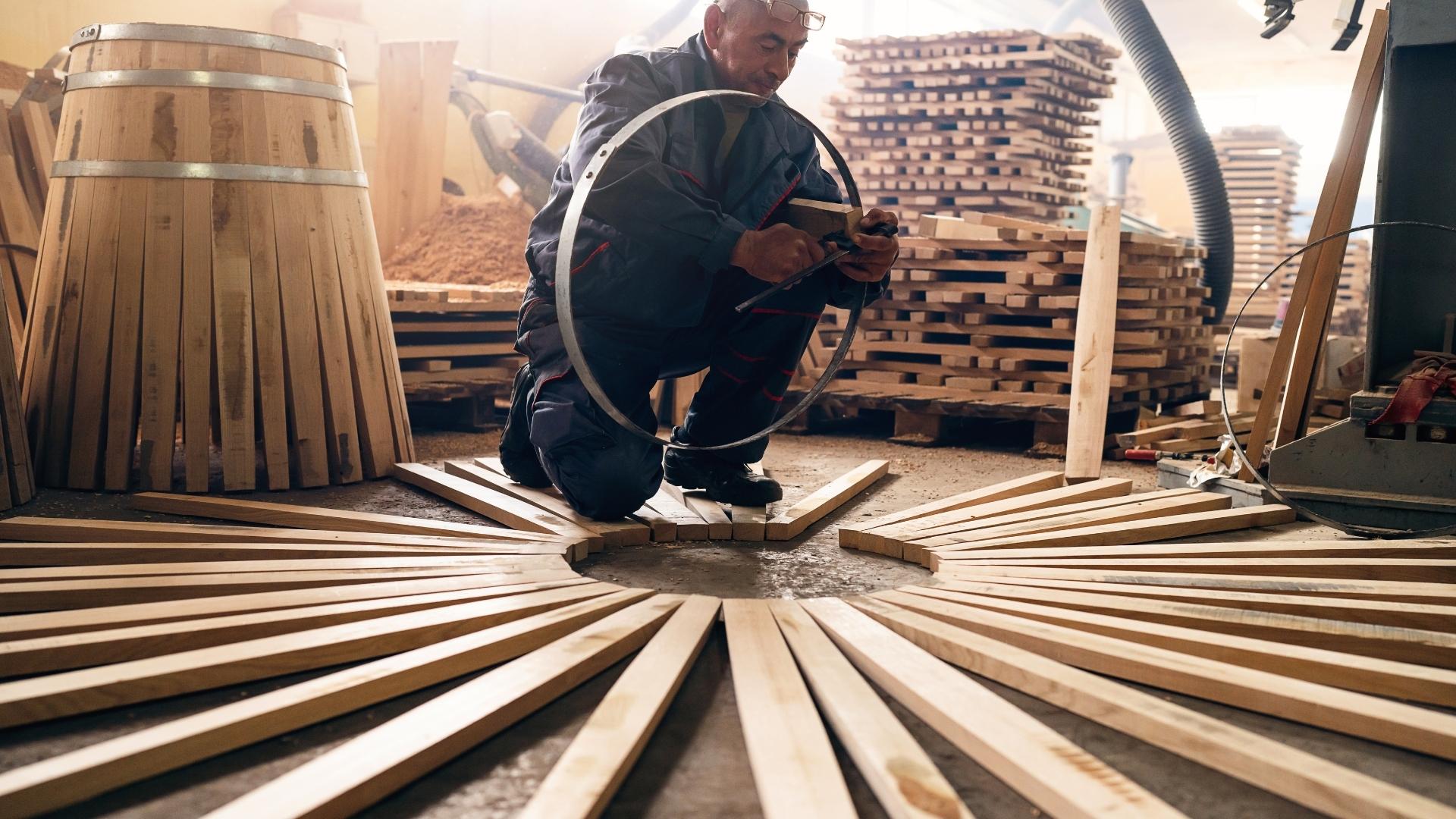 cooper making barrel; cooperage